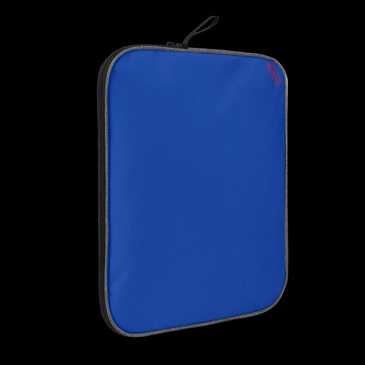 Slim-profile Blue Blank Slate tech sleeve showing the impact-resistant padded edges for MacBook and iPad protection.