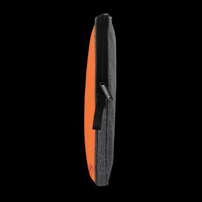 Heavy-duty snag-free zipper detail on the Orange Blank Slate Laptop Sleeve for secure, school-ready device storage.
